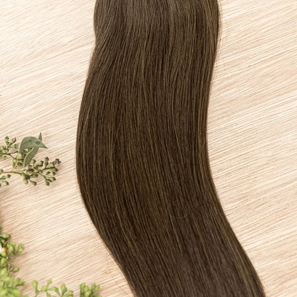 LINDEN MACHINE WEFT 50g Linden machine weft is a 22" weft featuring natual-toned level 2 ash brown. These machine wefts offer the highest weft density, along with the flexibility to be custom sized, colored, and cut according to your preferences. The mach
