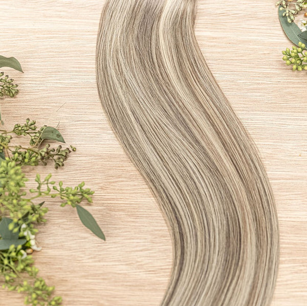 ALDER CLIP IN Alder clip-in hair extensions are 22 inches in length and made of a gorgeous weft of natural-toned level 7 ash and neutral level 10 warm blonde. They provide instant density and length when applied to the hair.These clip-in extensions can be