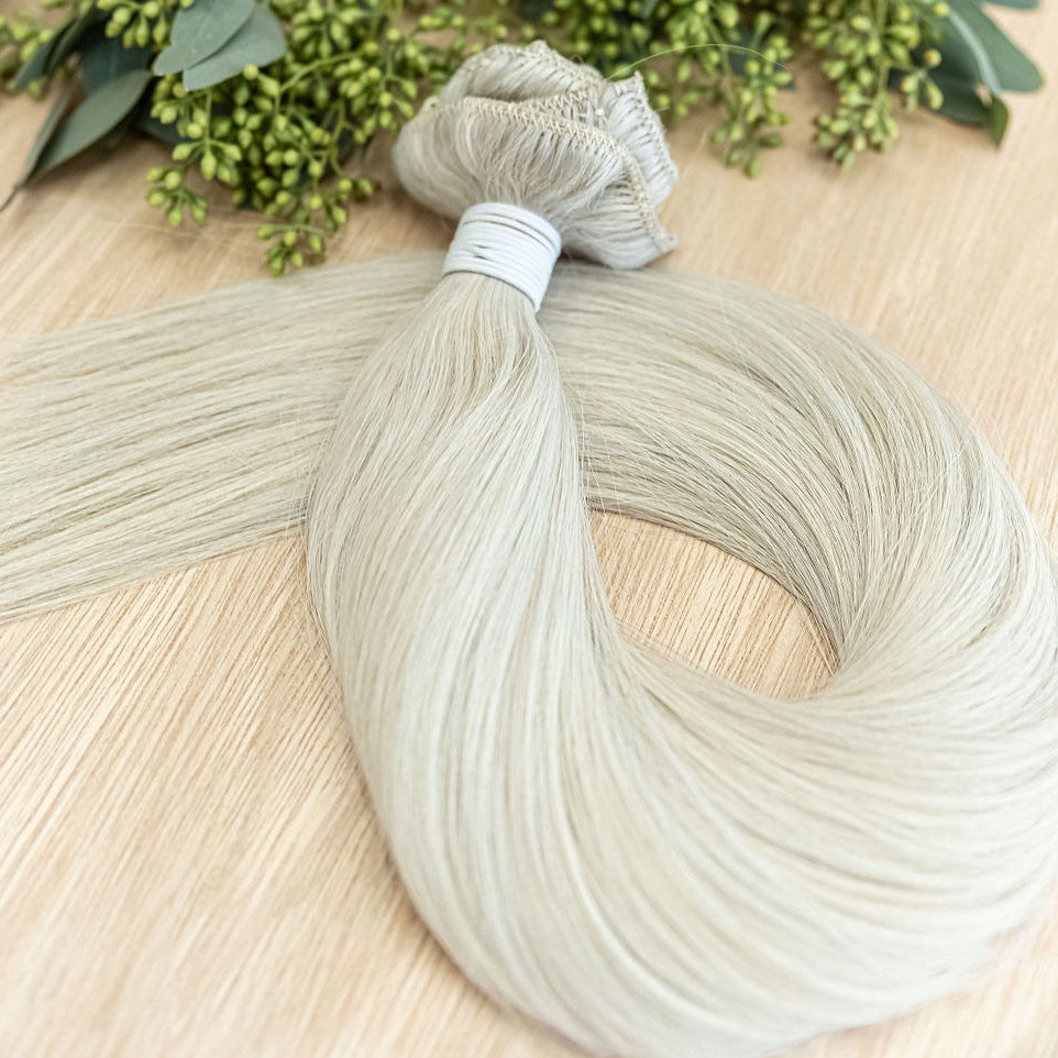 ASPEN CLIP IN Aspen clip-in hair extensions are 22 inches in length and made of a gorgeous weft of natural level10 ash platinum blonde. They provide instant density and length when applied to the hair. These clip-in extensions can be customized in terms o