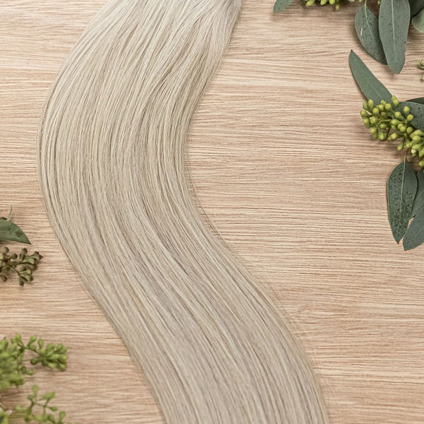 ASPEN HIBER WEFT Aspen Hiber Weft is a 22" weft is a natural level 10 ash platinum blonde shade. These wefts offer customization options, including custom sizing, cut, and a seamless fine root base without a return edge. The Hiber Wefts are 22" in length