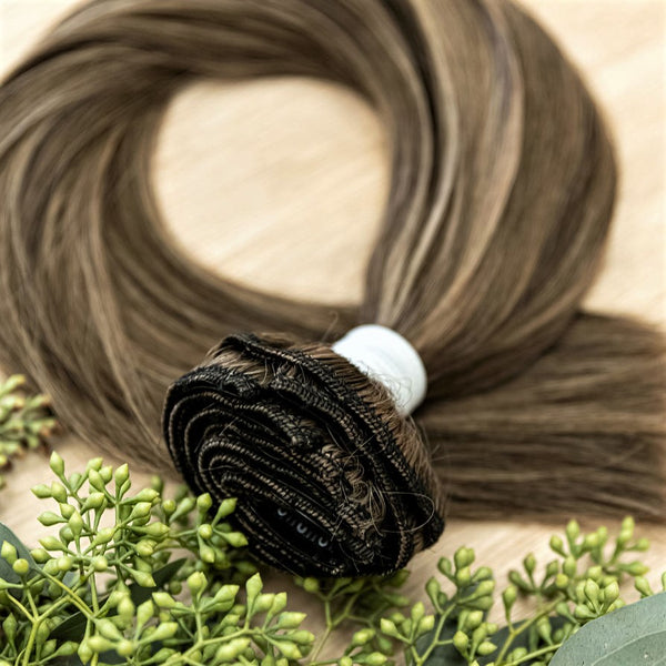 HICKORY CLIP IN Hickory clip-in hair extensions are 22 inches in length and made of a gorgeous weft of natural-toned level 2 brown and a level 8 warm blonde. They provide instant density and length when applied to the hair.These clip-in extensions can be