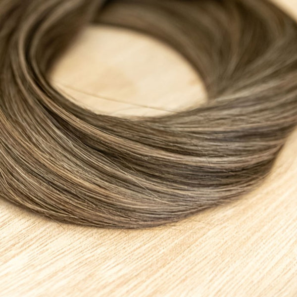 HICKORY CLIP IN Hickory clip-in hair extensions are 22 inches in length and made of a gorgeous weft of natural-toned level 2 brown and a level 8 warm blonde. They provide instant density and length when applied to the hair.These clip-in extensions can be