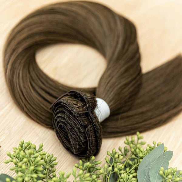 JUNIPER CLIP IN Juniper clip-in hair extensions are 22 inches in length and made of a gorgeous weft of natural-toned level 6 warm brown. They provide instant density and length when applied to the hair. These clip-in extensions can be customized in terms