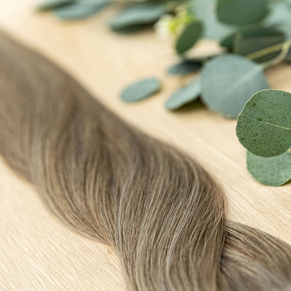 WALNUT HIBER WEFT Walnut Hiber Weft is a 22" weft is a natural level 6 & 8 combining these tonalities allows for mixture in warm and cool integrations. These wefts offer customization options, including custom sizing, cut, and a seamless fine root base wi